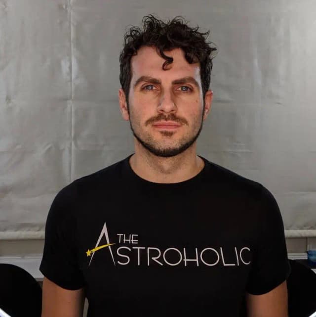 Dr. Alfredo Carpineti wearing a The Astroholic t-shirt