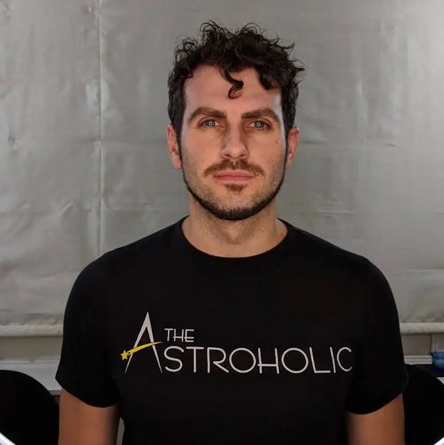 Dr. Alfredo Carpineti wearing a The Astroholic t-shirt